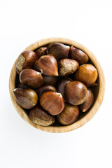 Chestnuts in a bowl isolated on white background
