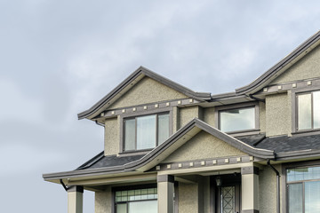 The top of the house or apartment building with nice window.