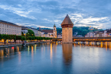 Night view towards Chapel Bridge (Kapellbruecke) together with the octagonal tall tower...
