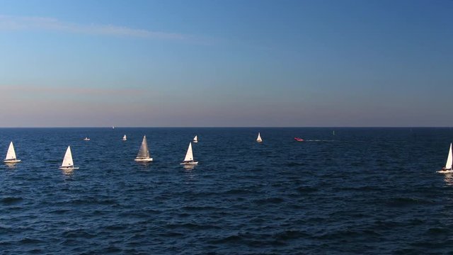 Aerial view of Sailing boats competing in the regatta at sea 