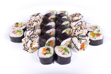 Japanese food restaurant, sushi maki gunkan roll plate or platter set. California  rolls with salmon.  isolated at white background. Top view, flat lay.