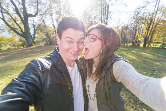 Young couple making funny Faces and take a Selfie