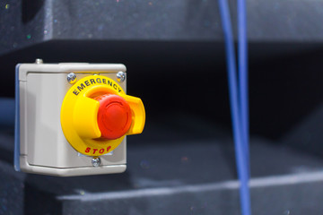 The red emergency button or stop button for Hand press. STOP But