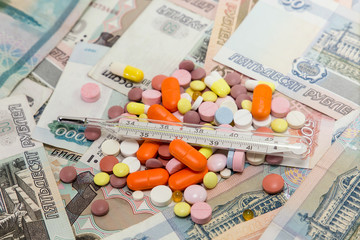Tablets, a thermometer, and a lot of money. paid medicine