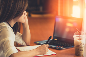 working women thinking to do work business job writer thinks and writing in notebook or computer...