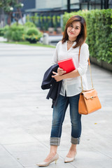 Thai business office worker in casual wear or working women smile and happy with going to work.