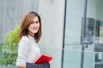 Thai business office worker in casual wear or working women smile and happy with going to work.