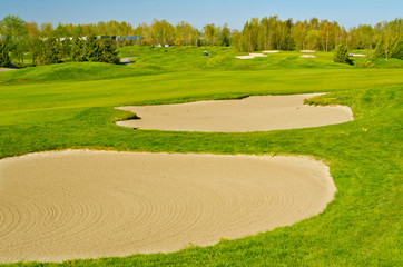 Sand bunker on the golf course.