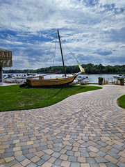 Old boat monument with beautiful blue sky and clouds background