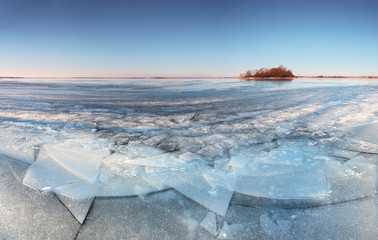 Blue sky above frozen lake