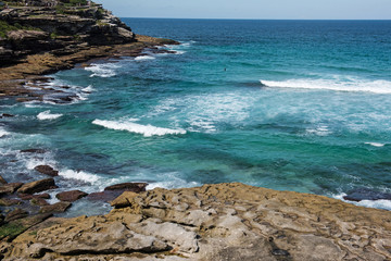 Fototapeta na wymiar Bondi to Coogee coastal walk, Sydney, Australia. A cliff top coastal walk extends for 6 km in Sydney's eastern suburbs. The walk features stunning views, beaches, parks, cliffs, bays and rock pools