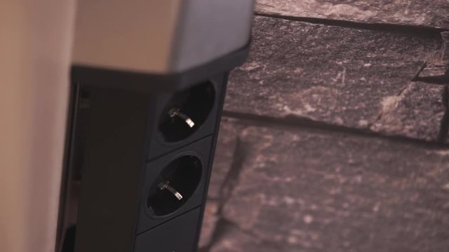 hidden electrical outlet furniture in closeup