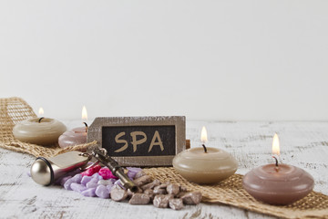 SPA concept with candles and door key