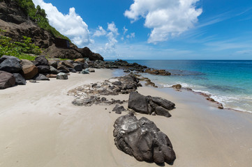 Rocks on the Sand with the Sea Beyond