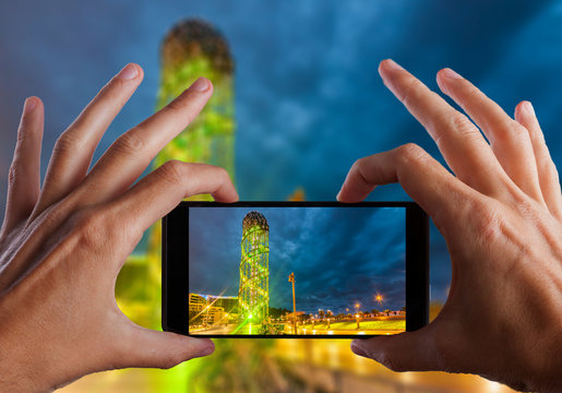 Travel concept. Hand making photo of city with smartphone camera. BATUMI, ADJARA, GEORGIA