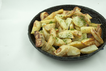 Potato wedges in the pan