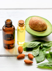 avocado oil for handmade cosmetics on wooden background