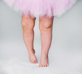 baby girl like a ballet dancer in pink tutu, isolated on white background
