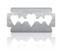 Razor blade with heart shape and reflection. Isolated on white