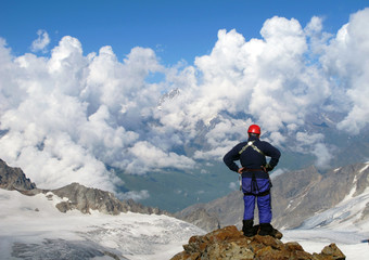 Climber on the top of the mountain