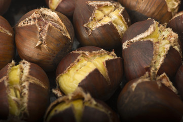 group of chestnuts on a wooden table
