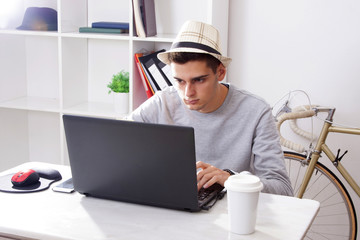 man with laptop in house