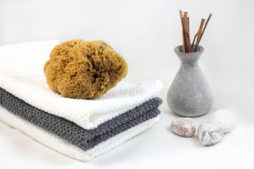 Aromatherapy and SPA concept. Towel and sea sponge.