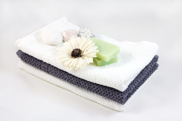 Obraz na płótnie Canvas Aromatherapy and SPA concept. Soap with flower on towel