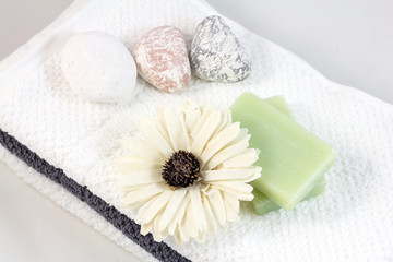 Aromatherapy and SPA concept. Soap with flower on towel