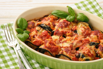 Casserole with roasted eggplants stuffed with minced meat.