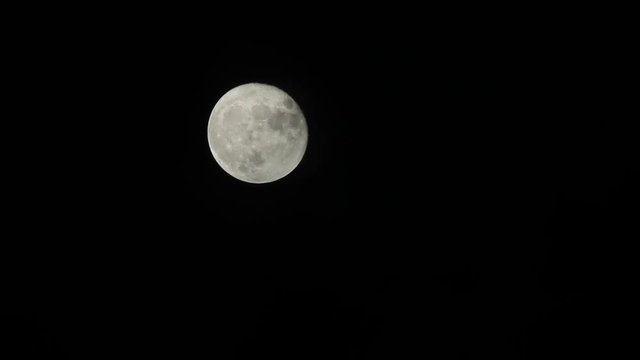 Full moon moving across the sky  very fast. Night timelapse video.
