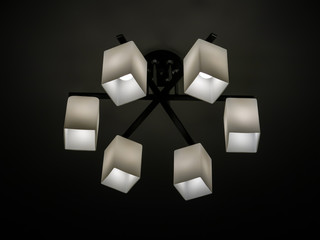 chandelier in a modern style, which is hanging on the ceiling