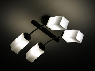 chandelier in a modern style, which is hanging on the ceiling