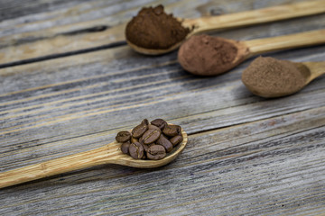 beautiful little wooden spoon with coffee on  background