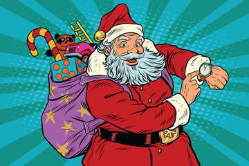 Santa Claus shows on the clock, New year and Christmas