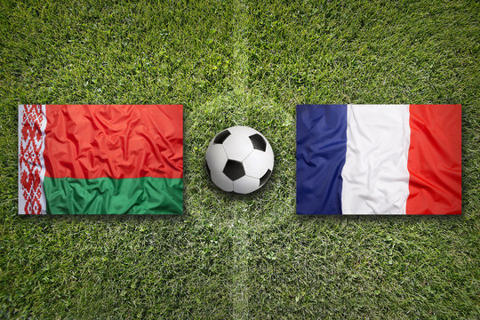 Belarus vs. France flags on soccer field