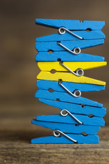 colorful wooden clothespin - standing out from the crowd, leadership, difference concept. selective focus, toned image 