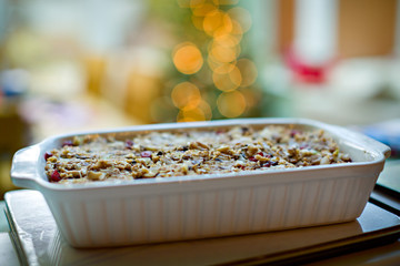 Freshly cooked Nut Roast in a baking dish with  blurred lights in the background. Vegetarian...