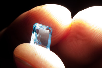 Cutter demonstrates gemstone topaz