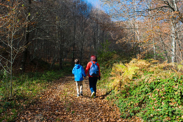 Fototapeta premium Mother and son enjoying autumn