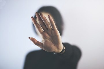 Young woman showing hand No