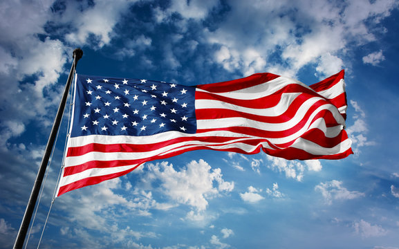 American flag on blue sky with beauty clouds