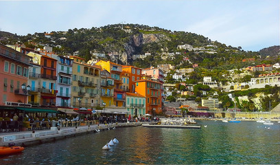 Colorful buildings with traditional architecture near the harbor of Villefranche sur Mer, French Riviera, France