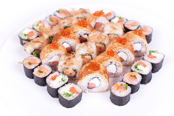 Japanese food restaurant, sushi maki gunkan roll plate or platter set. California  rolls with salmon.  isolated at white background. Top view, flat lay.