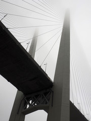 Detail of golden bridge in the fog. Bottom view. Vladivostok. Russia