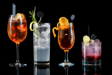 tasty cocktails drinks on black background