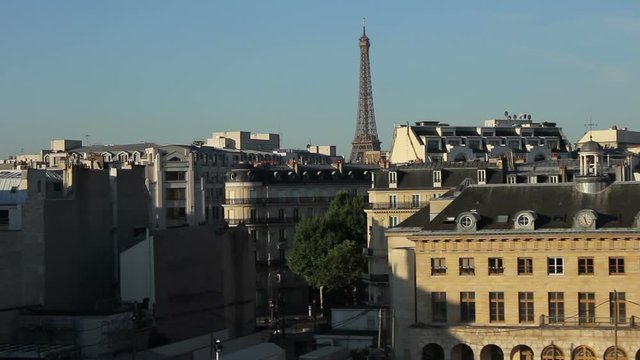 Paris time lapse with Parisian streets and Eiffel Tower set in the background. Filmed on the rooftop of Paris