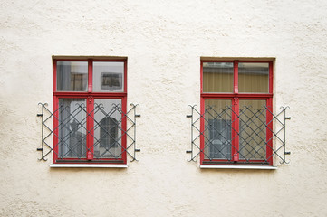 House wall with red windows in Riga