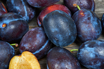 Fresh plums in a wooden basket