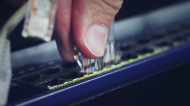 Network cables being plugged in